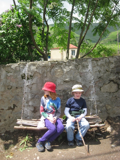 cielo and aquil on a bench