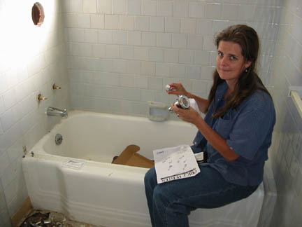 Alison shows off the new fixtures for the tub